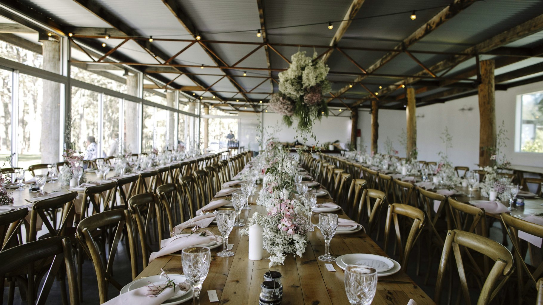 Tables styled for a wedding reception.